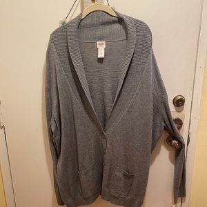 Variety of plus size sweaters and tops.
